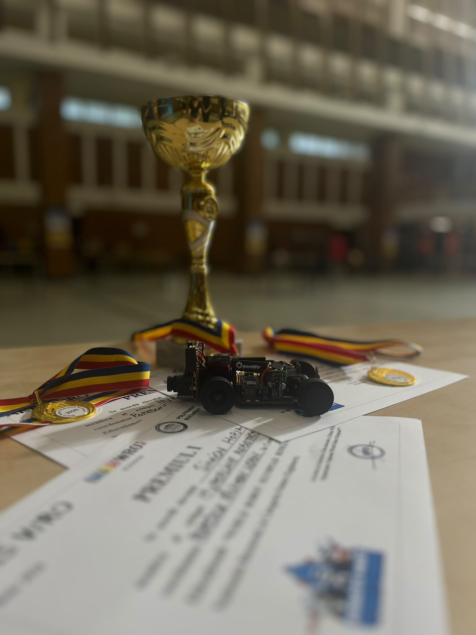 HLR Self-Driving Car V2 with WRO 2026 trophy, medals and certificate